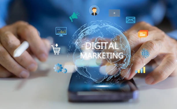 istockphoto-1936789233-612×612 Human use phone with digital online marketing commerce sale, website advertising, promotion of products, digital marketing strategy and goals, digital search engine, SEO, social media, ads, E-commerce